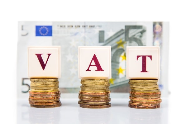 Value Added Tax concept with stack of coin and EURO currency